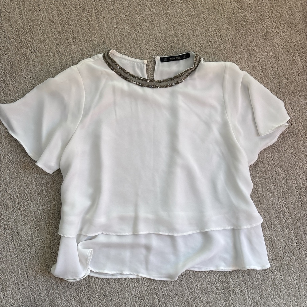 Flowy blouse with jewel detail collar